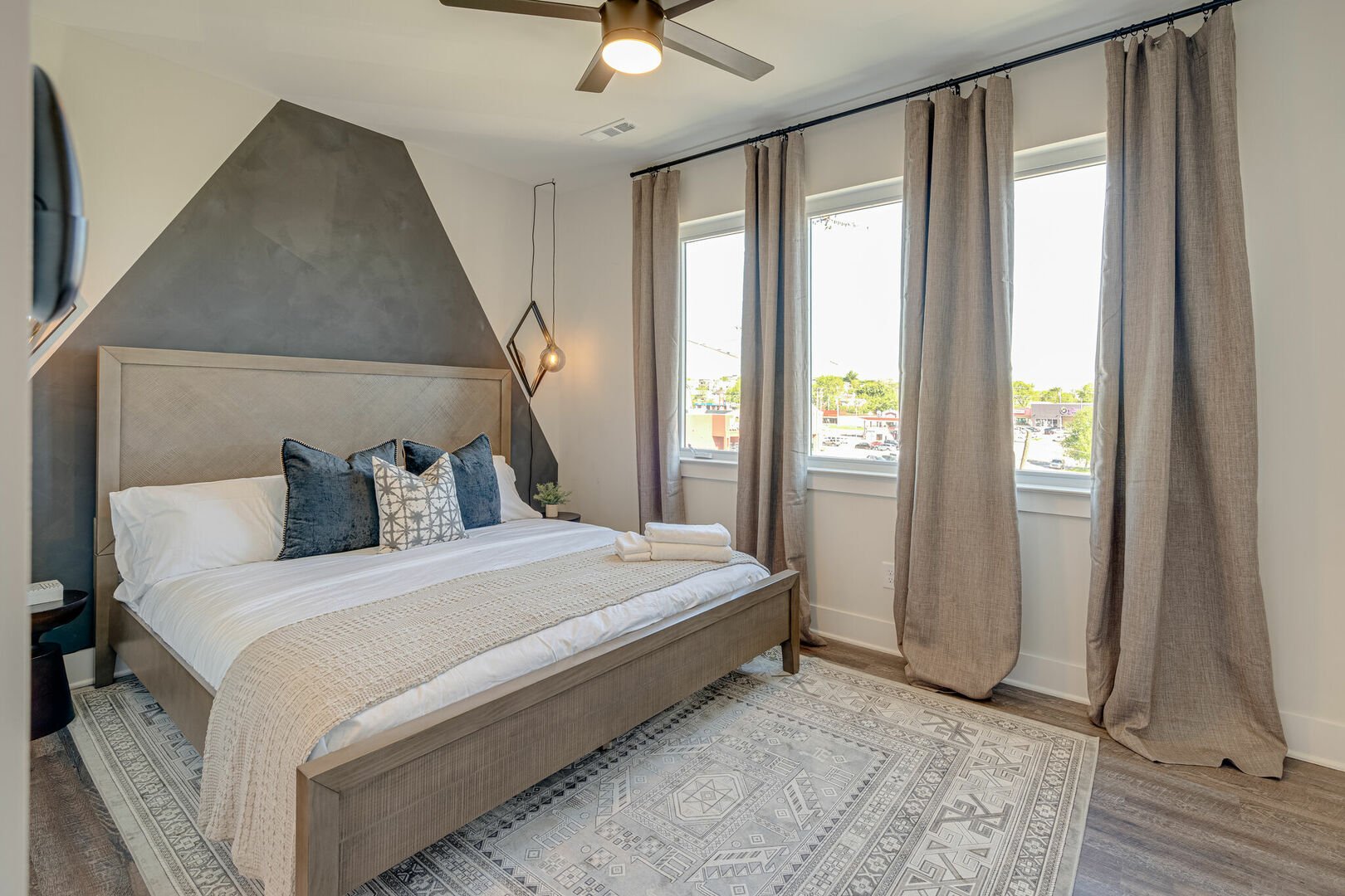 3rd floor: 2nd Bedroom featuring a King bed and designer furnishings with ensuite bathroom.