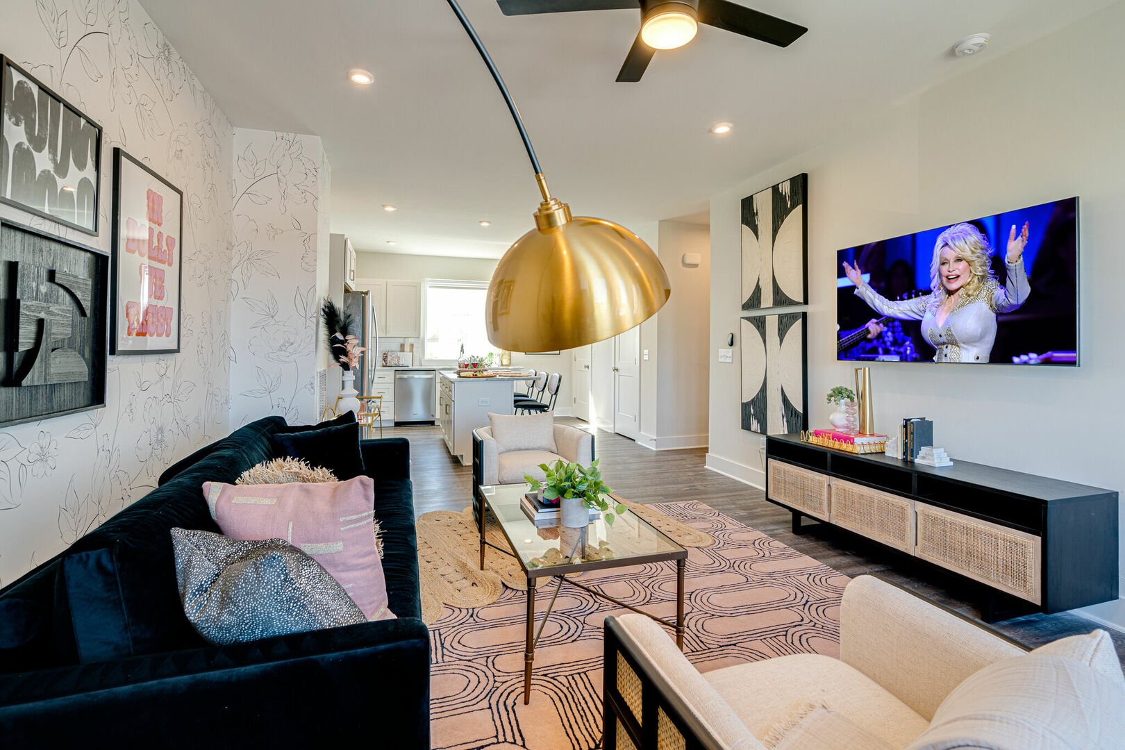 Bright and open living space complete with designer furnishings and smart TV.