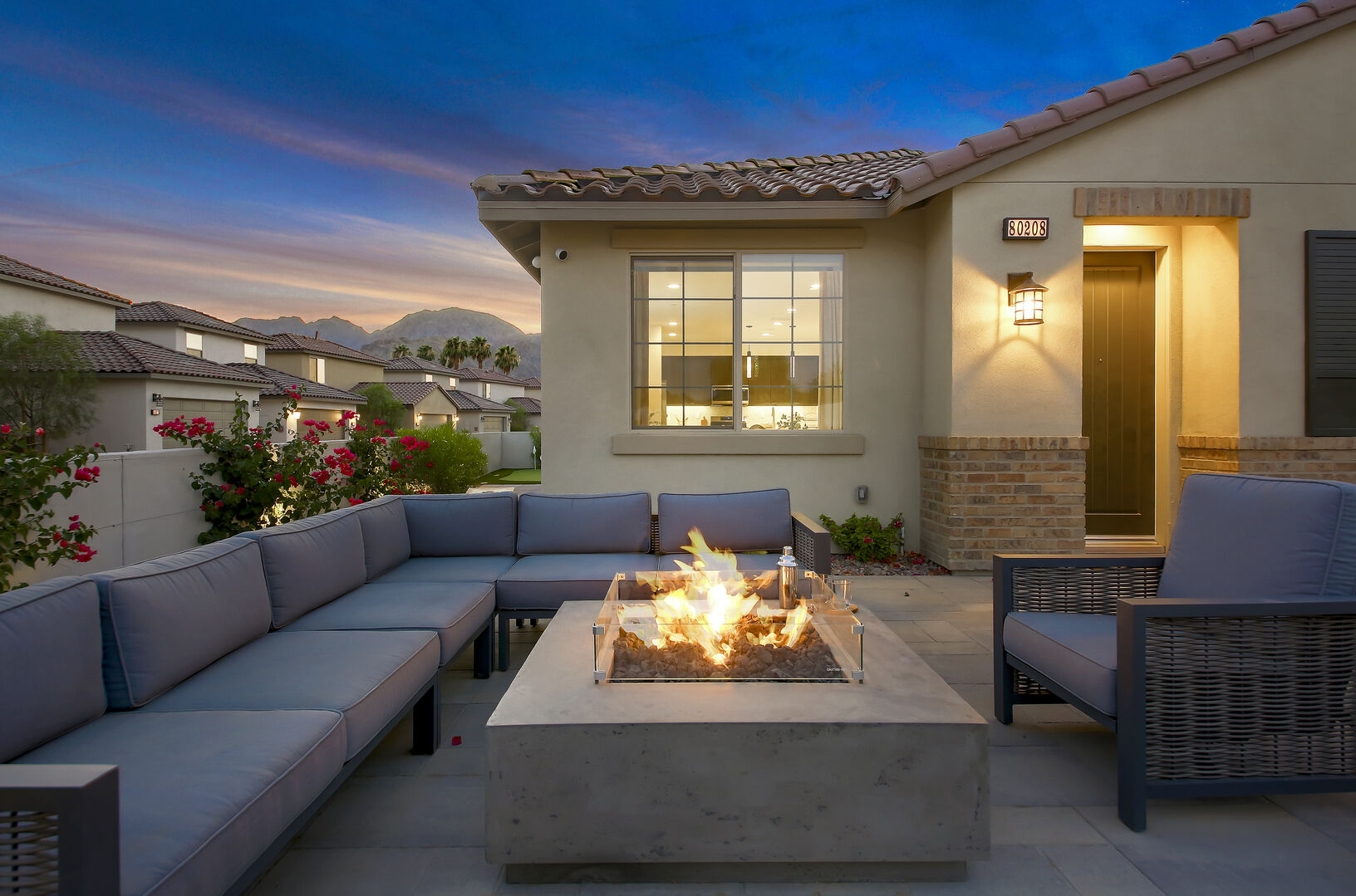 Gather around the natural gas fire pit and seating up to 8 guests.