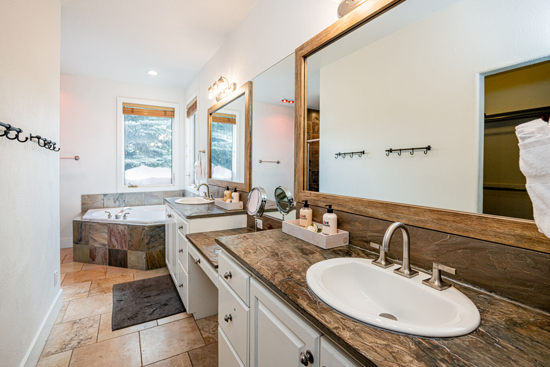 Grand Master Bathroom with Two Vanities, a Jetted Tub and Shower