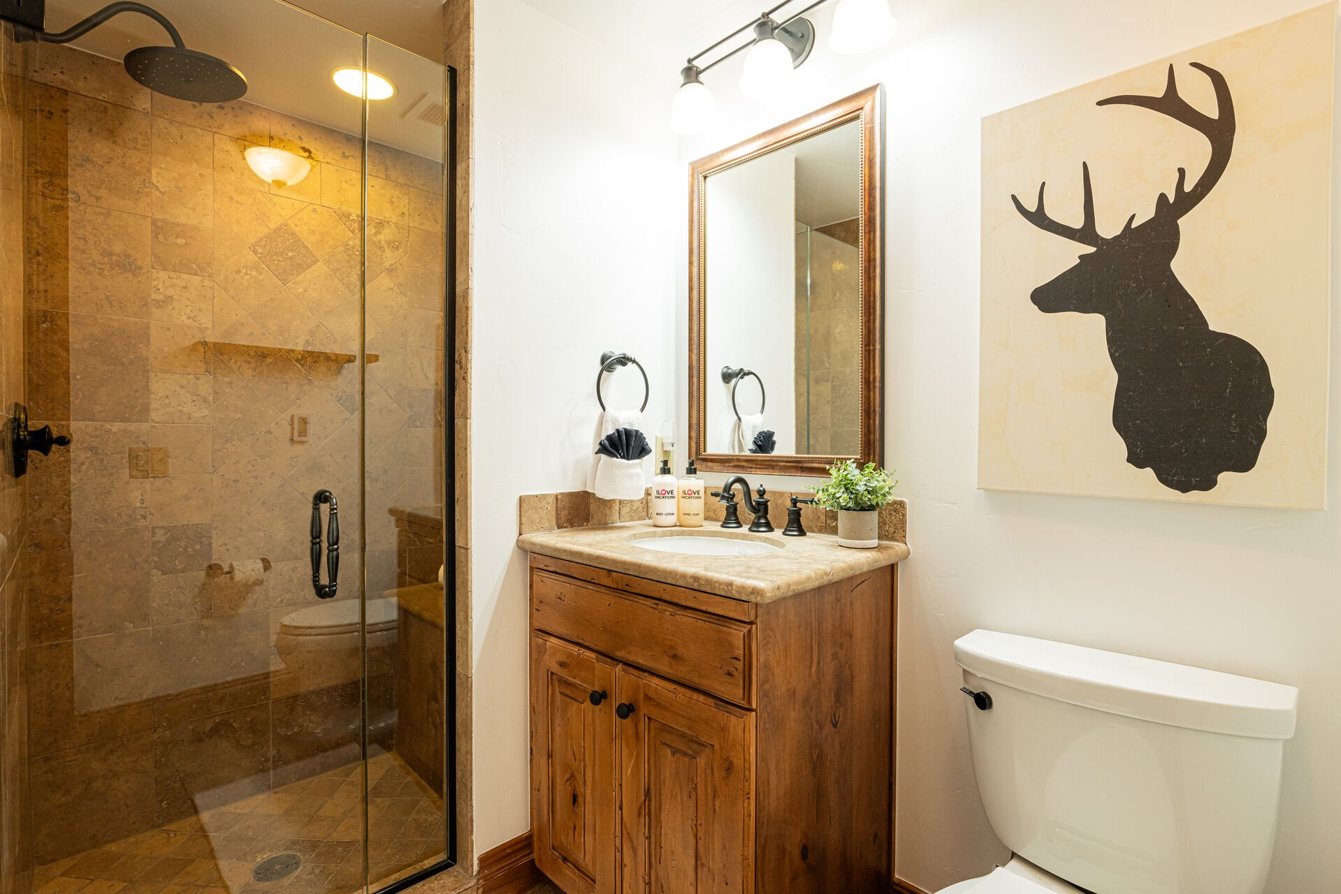 Bedroom 4 en suite bathroom with glass / tile shower