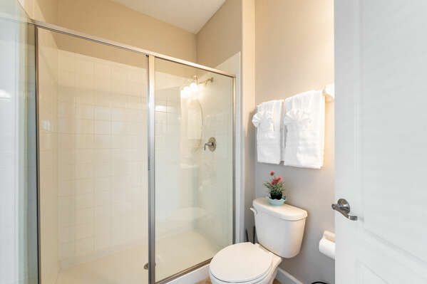 Downstairs shared bath with shower and pedestal sink