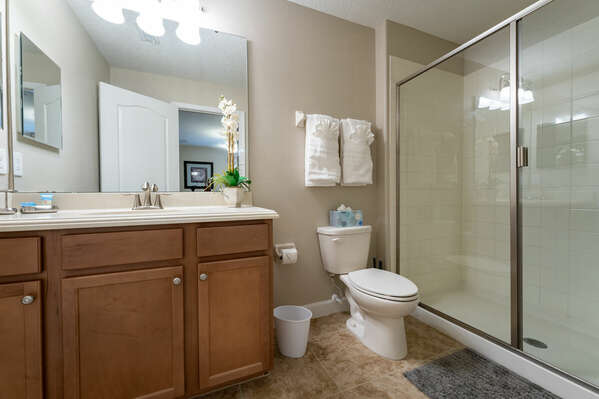 EN-suite bath for bedroom 5 with shower and single sink vanity