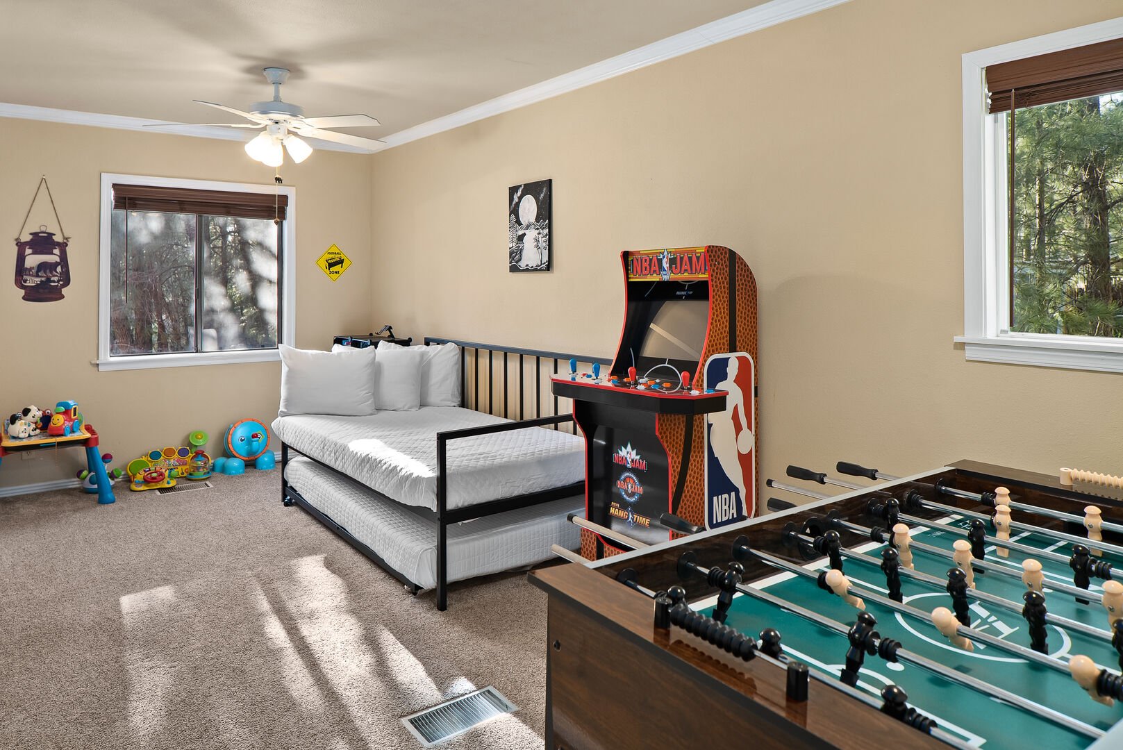 Bedroom 3 offers toys and books for the kids, NBA Jam Arcade and a Foosball table.
