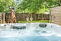 Relax in the hot tub and enjoy a drink outside in the private backyard