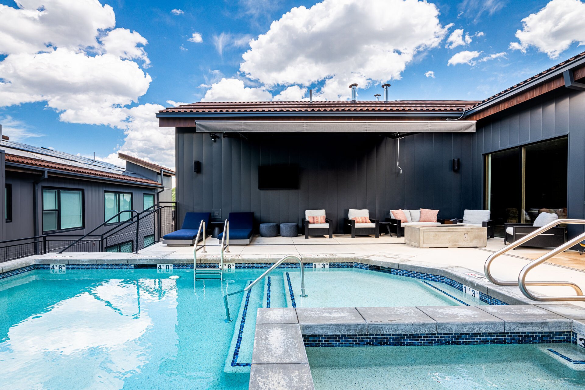 Community pool and Hot tub with poolside seating