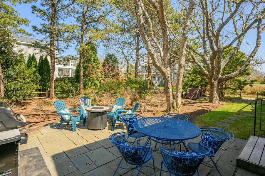 Dining table and adjacent firepit area for everyone to enjoy - 18 Beach Road West Harwich - Cape Cod - Beach Plum Cottage - NEVR