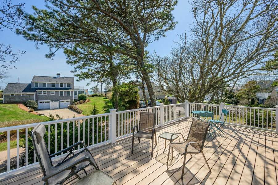 Peek-a-boo views of the ocean from this upper level deck - 18 Beach Road West Harwich - Cape Cod - Beach Plum Cottage - NEVR