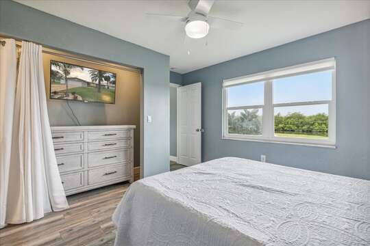 Master bedroom with view of the pool and river!