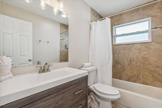 Guest bathroom with shower tub combo