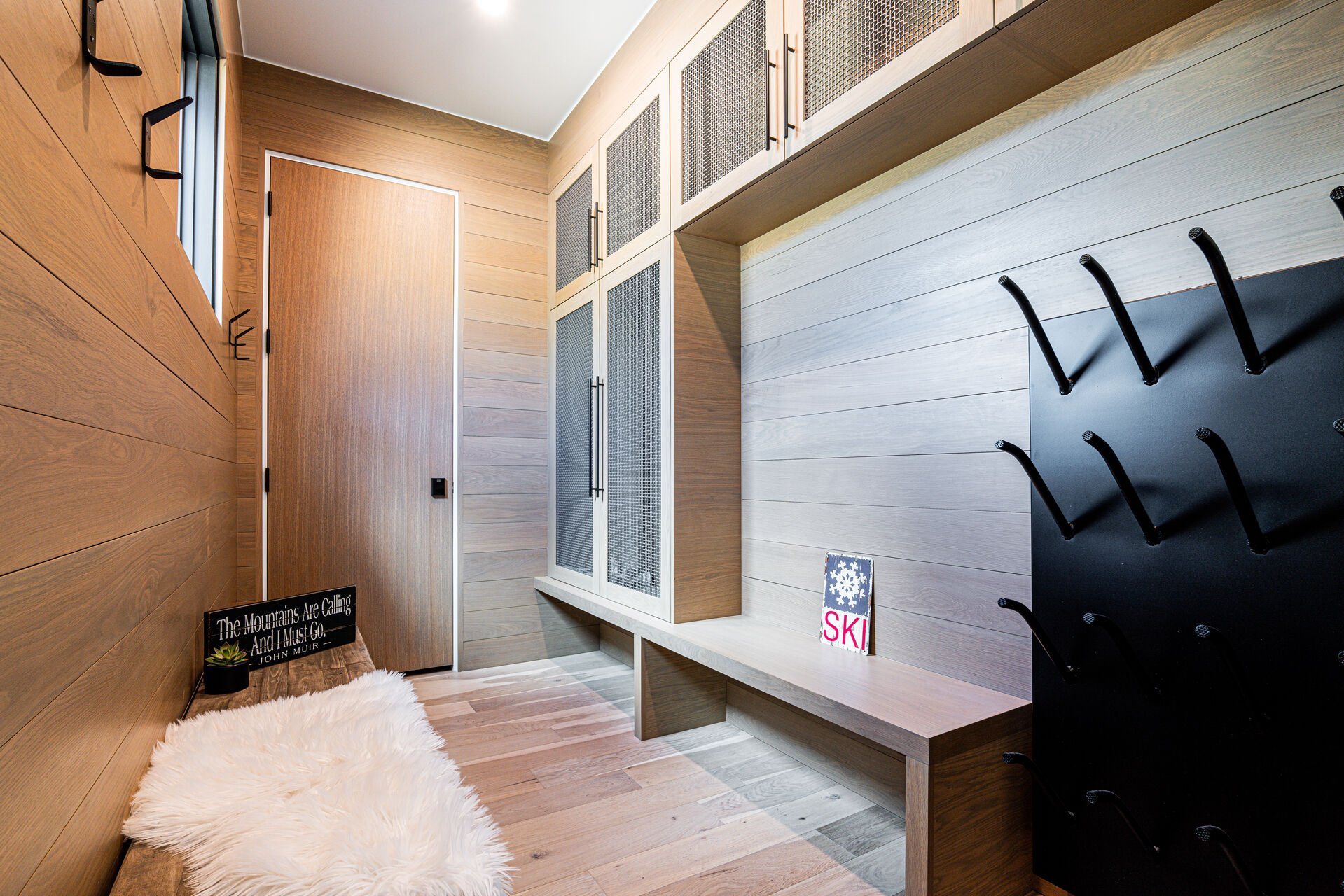 Mudroom with storage space and boot heaters