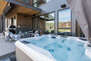Spend the evening on the patio enjoying the private hot tub, patio seating with fire table