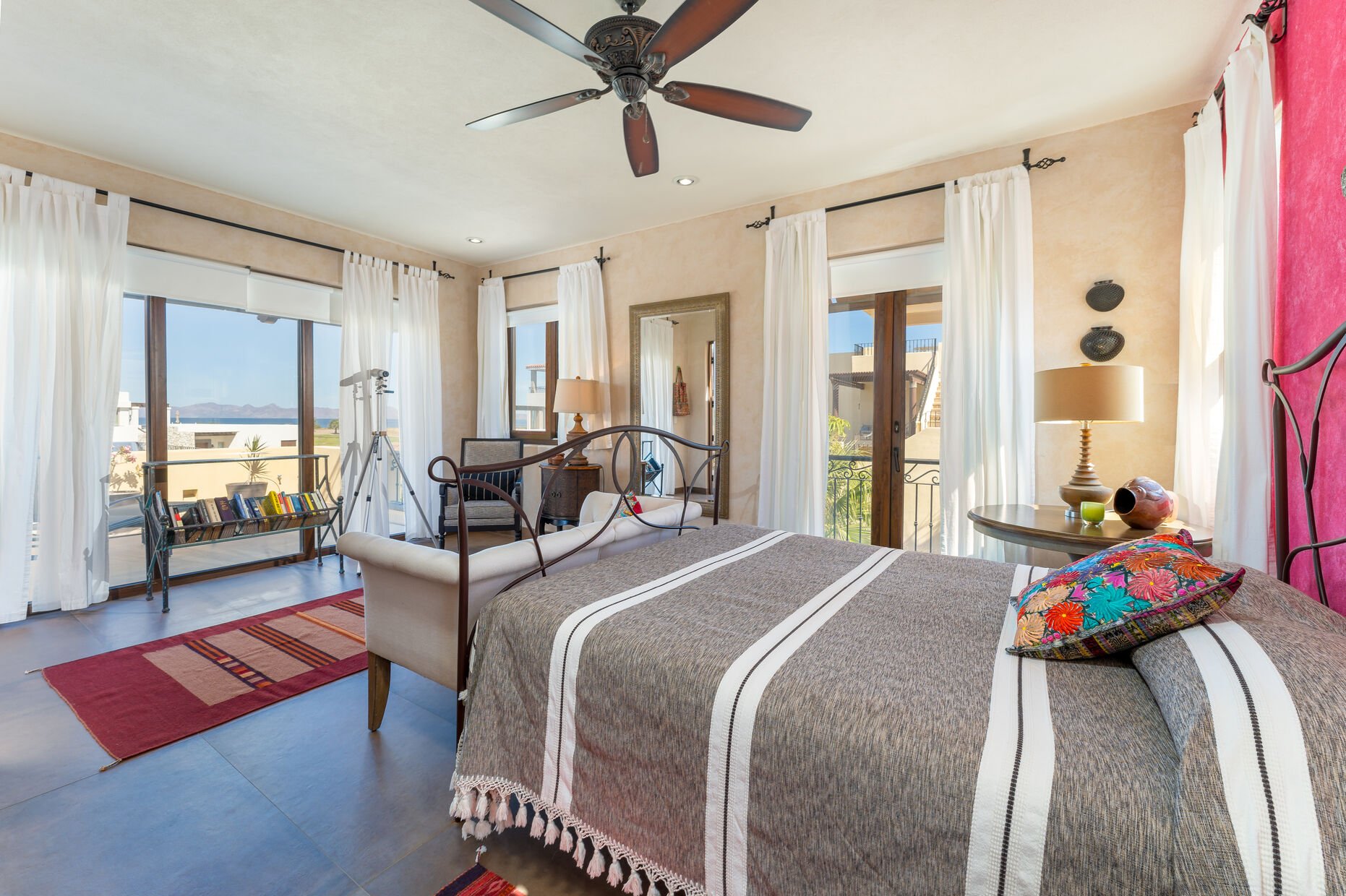 Master bedroom with Queen bed, small patio and Sea of Cortez view