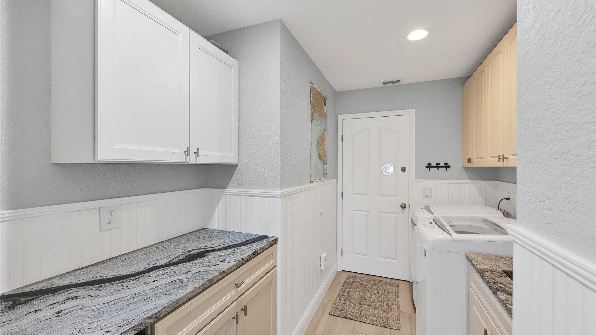 Full size laundry room leads to garage