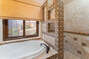 Master bath with twin vanity, soaking tub and shower