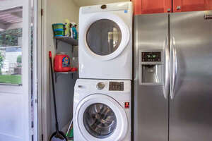 Stackable full capacity washer and dryer. A starter kit of supplies is provided