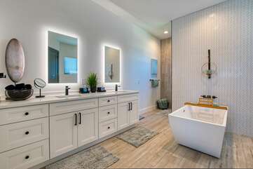 master bathroom with walk in shower and soaking tub