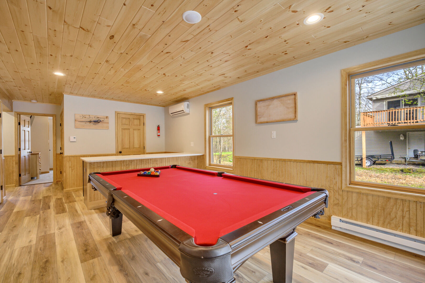 Rack 'em up. 1st Floor Game Room with Pool Table and Bar.