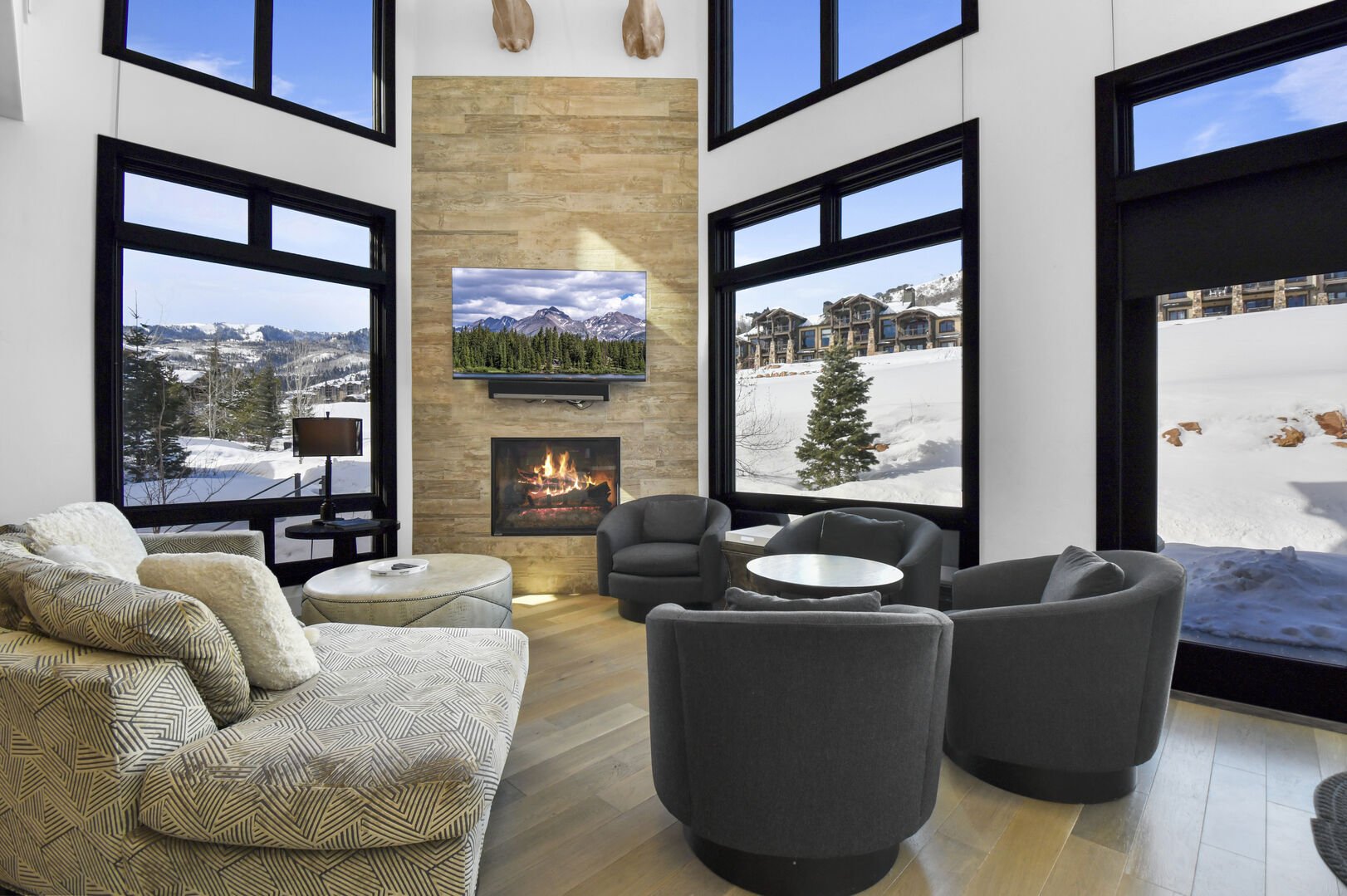 Relax in luxury with golf course and mountain views beyond.