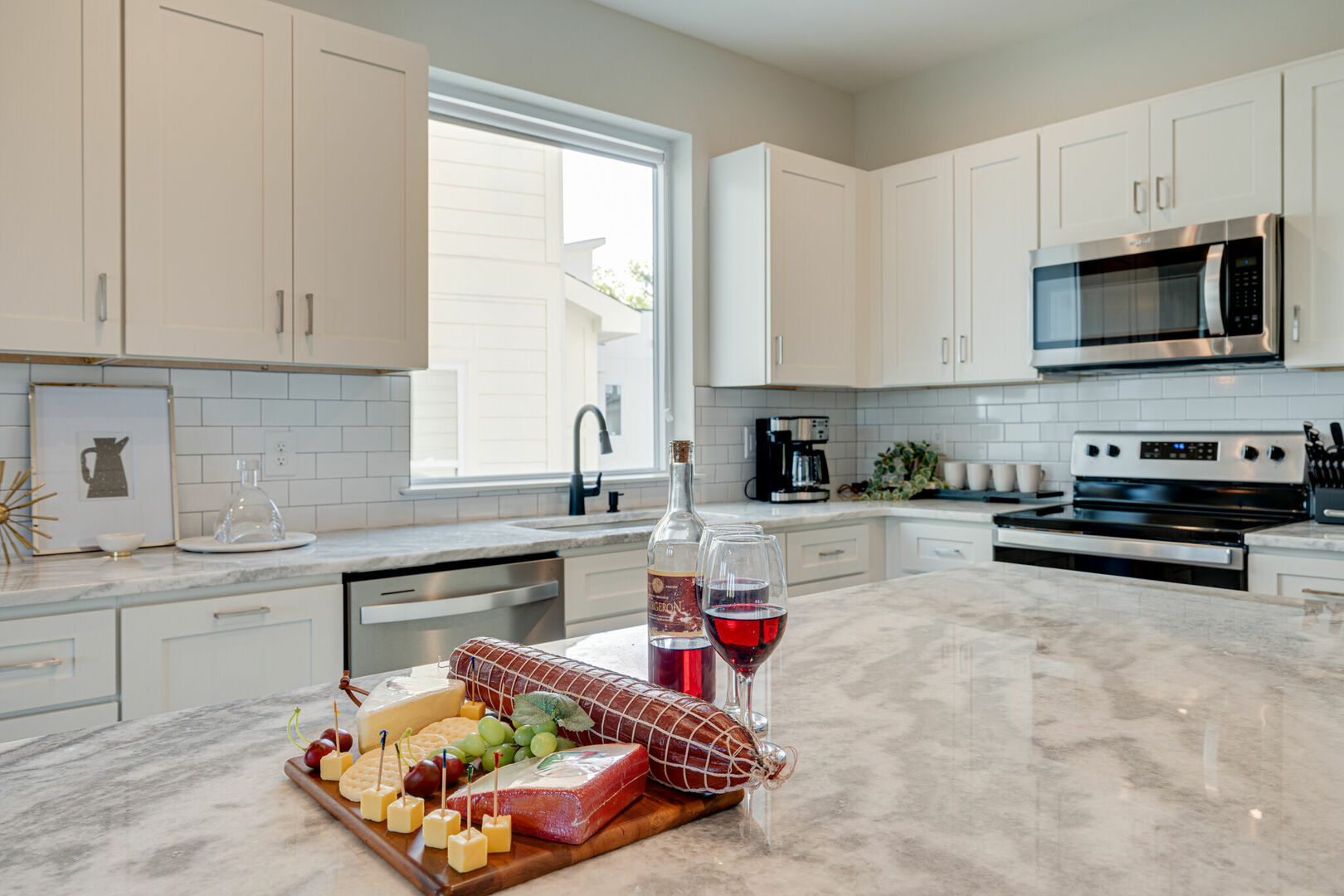 Fully Equipped Kitchen stocked with your basic cooking essentials and stainless-steel appliances. (2nd Floor) -Unit 1-