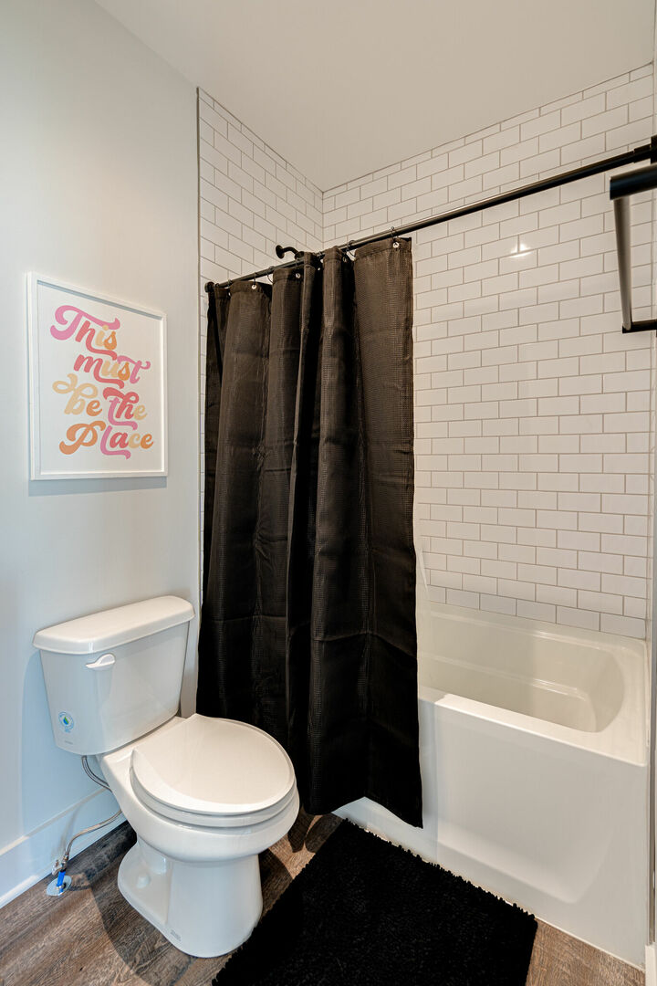 Primary bathroom with a shower and tub combo. (3rd Floor) -Unit 2-