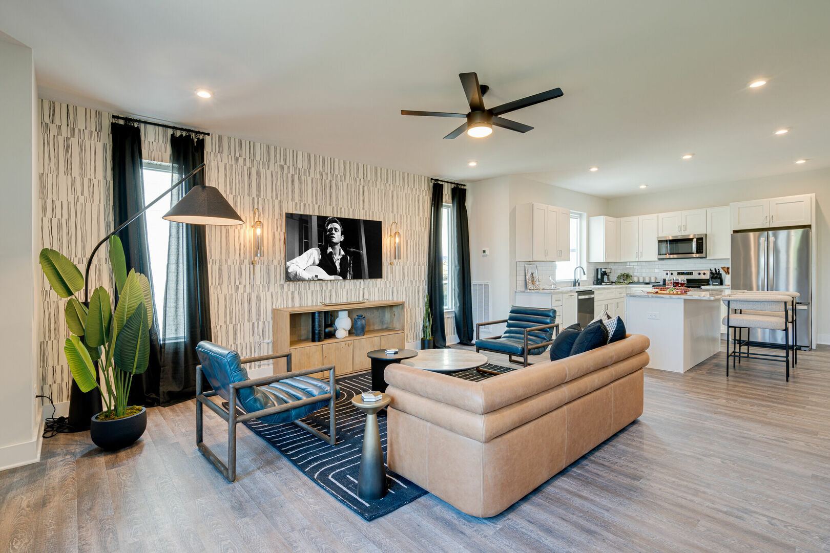 3rd Unit, 2nd Floor: Open concept bring living space featuring a smart flat-screen tv and designer furnishings.