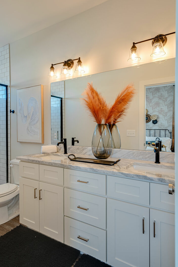 Primary Bathroom features a dual vanity and stand-in shower. (3rd Floor) -Unit 3-
