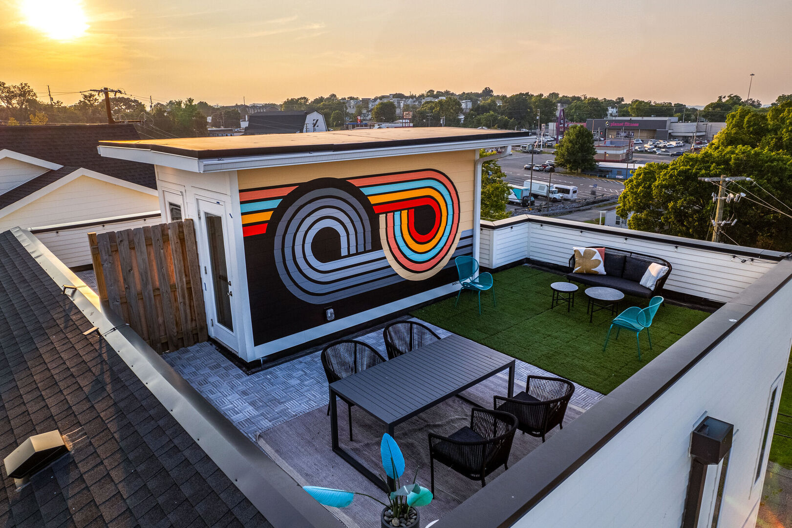 1st Unit, 4th Floor: Private rooftop deck outdoor dining table (seats 4) and lounge area. Entire space is lined with bistro lights and includes a photo op mural!