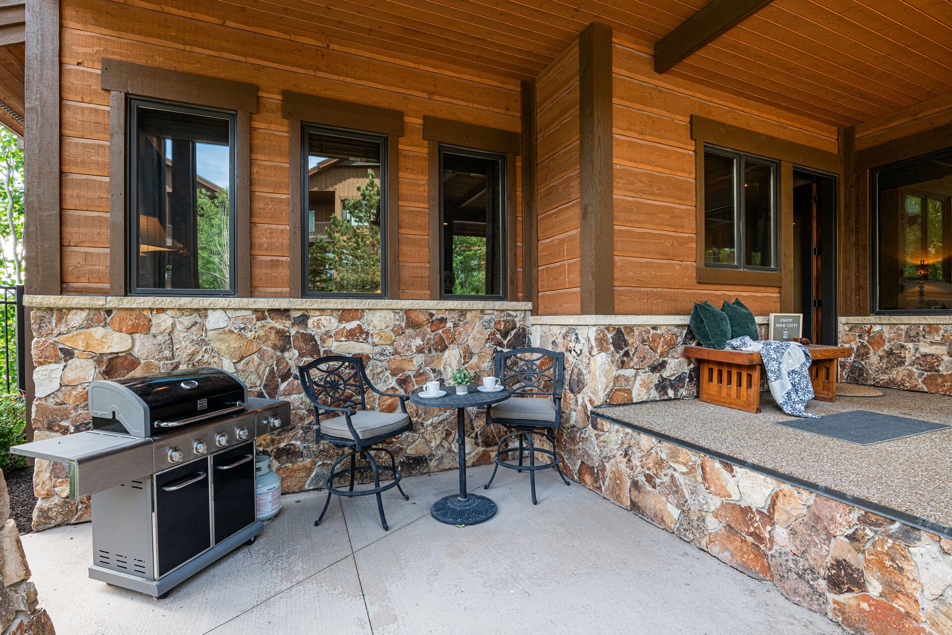 Outdoor bistro style seating with propane grill