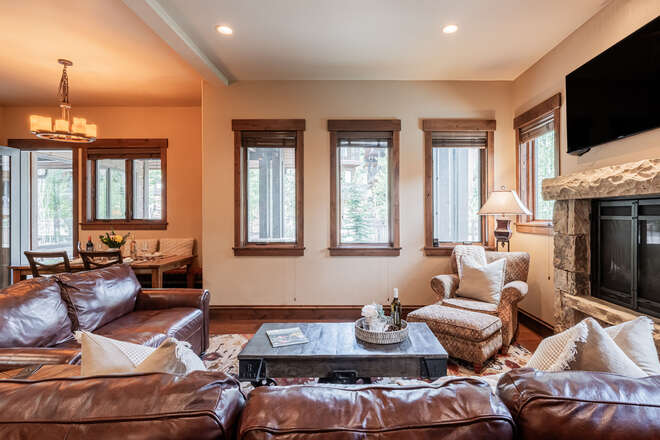 Living room with ample seating, gas fireplace, and Smart TV