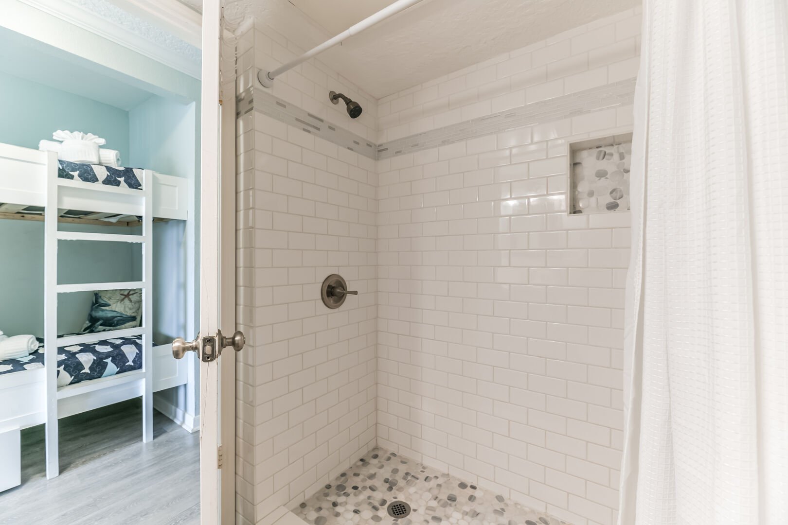 Custom tiled, walk-in shower for a warm, relaxing end of the day.