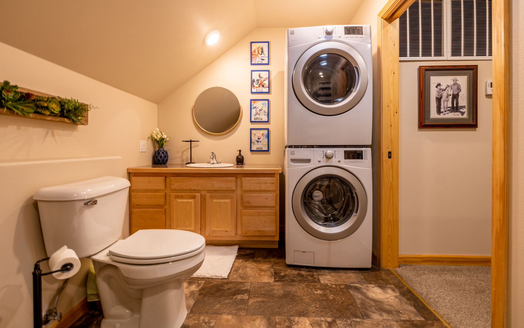 Upper level bathroom with stackable washer/dryer