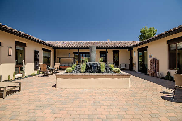 Spacious Front Courtyard with Stunning Water Fountain and Plenty of Outside Seating