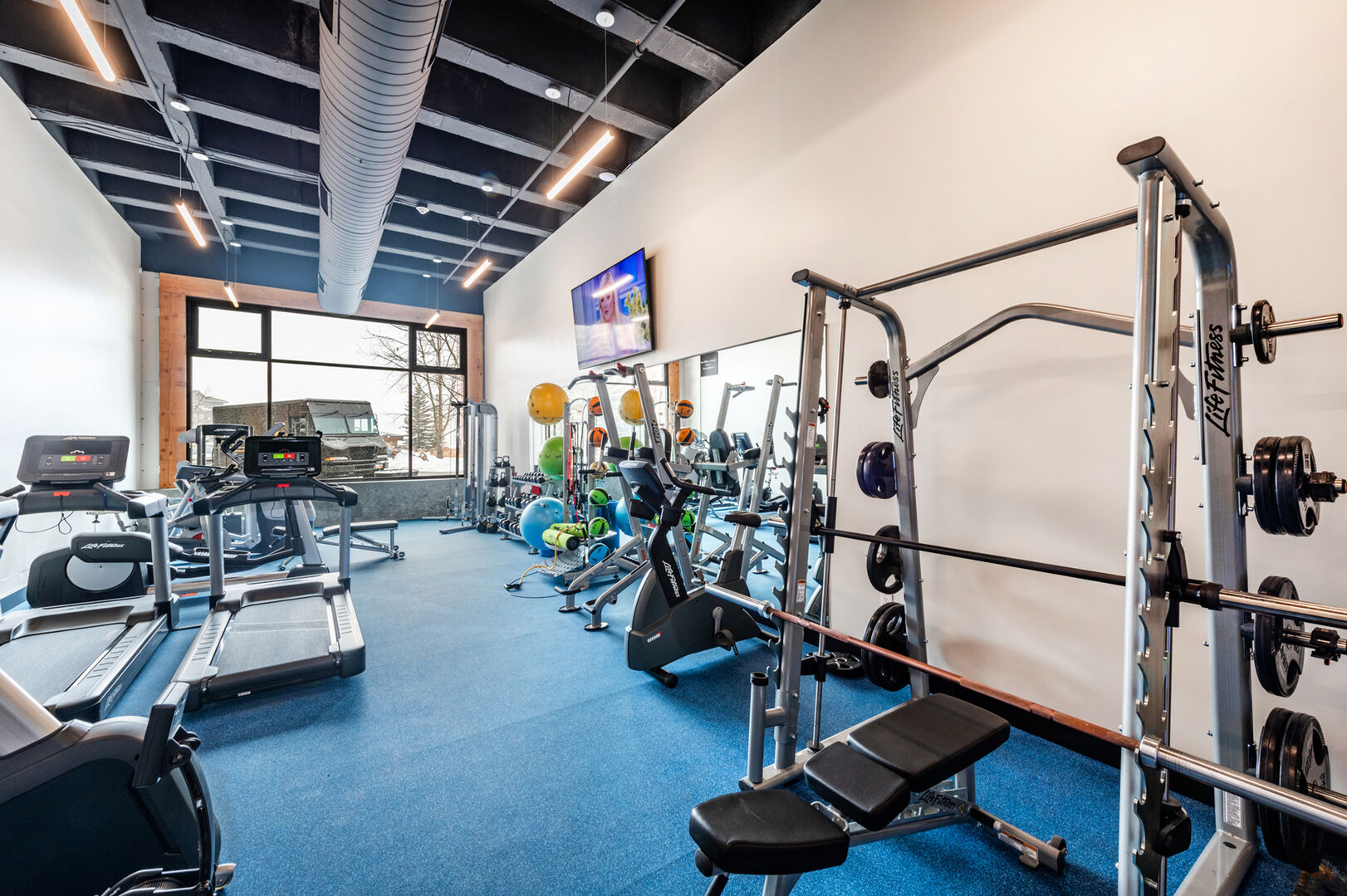 Sundial Lounge fitness room with free weights