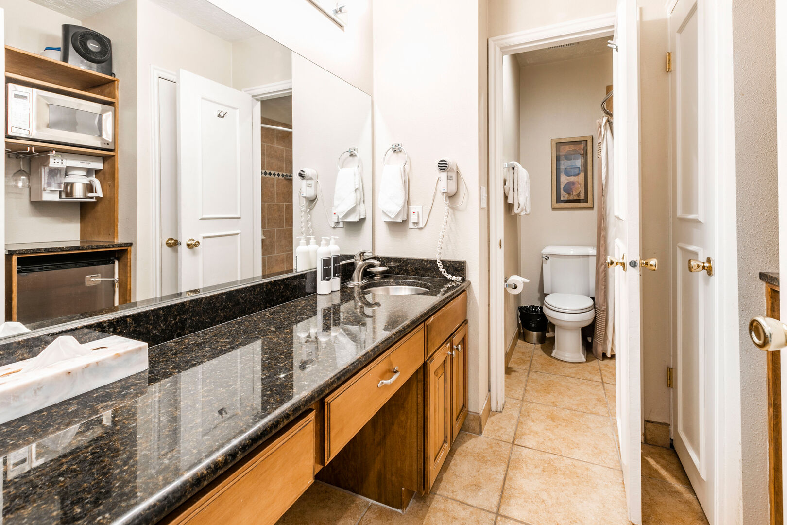 Primary Bathroom with Microwave, Mini Fridge, and Coffee Maker + Bathtub/Shower Combo