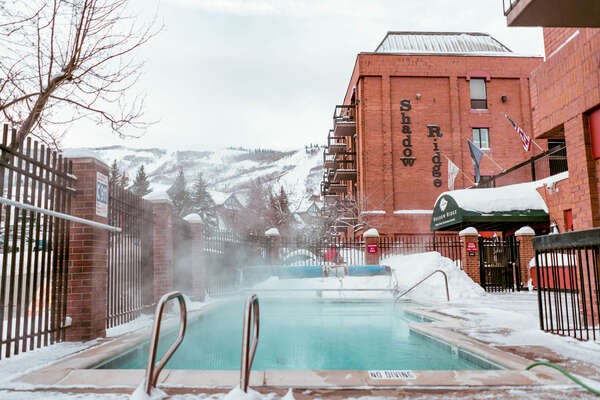 Outdoor heated pool with ski-run views!