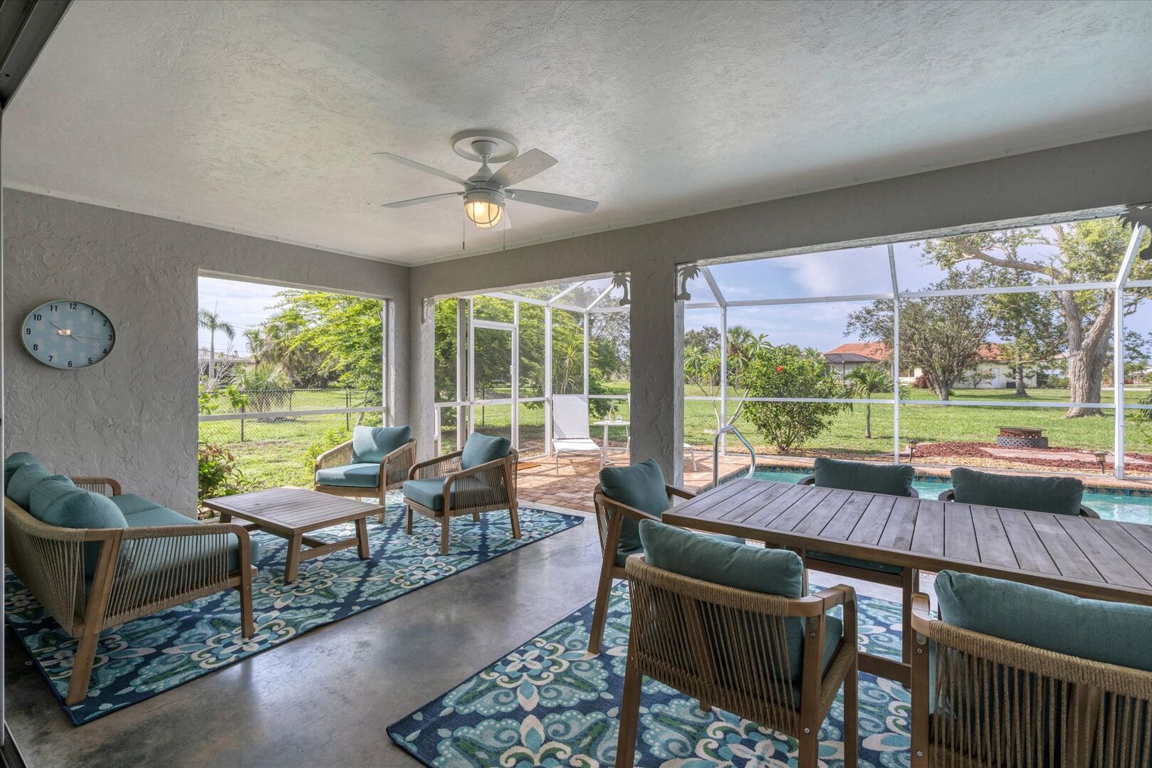 Spacious lanai with covered seating areas and pool