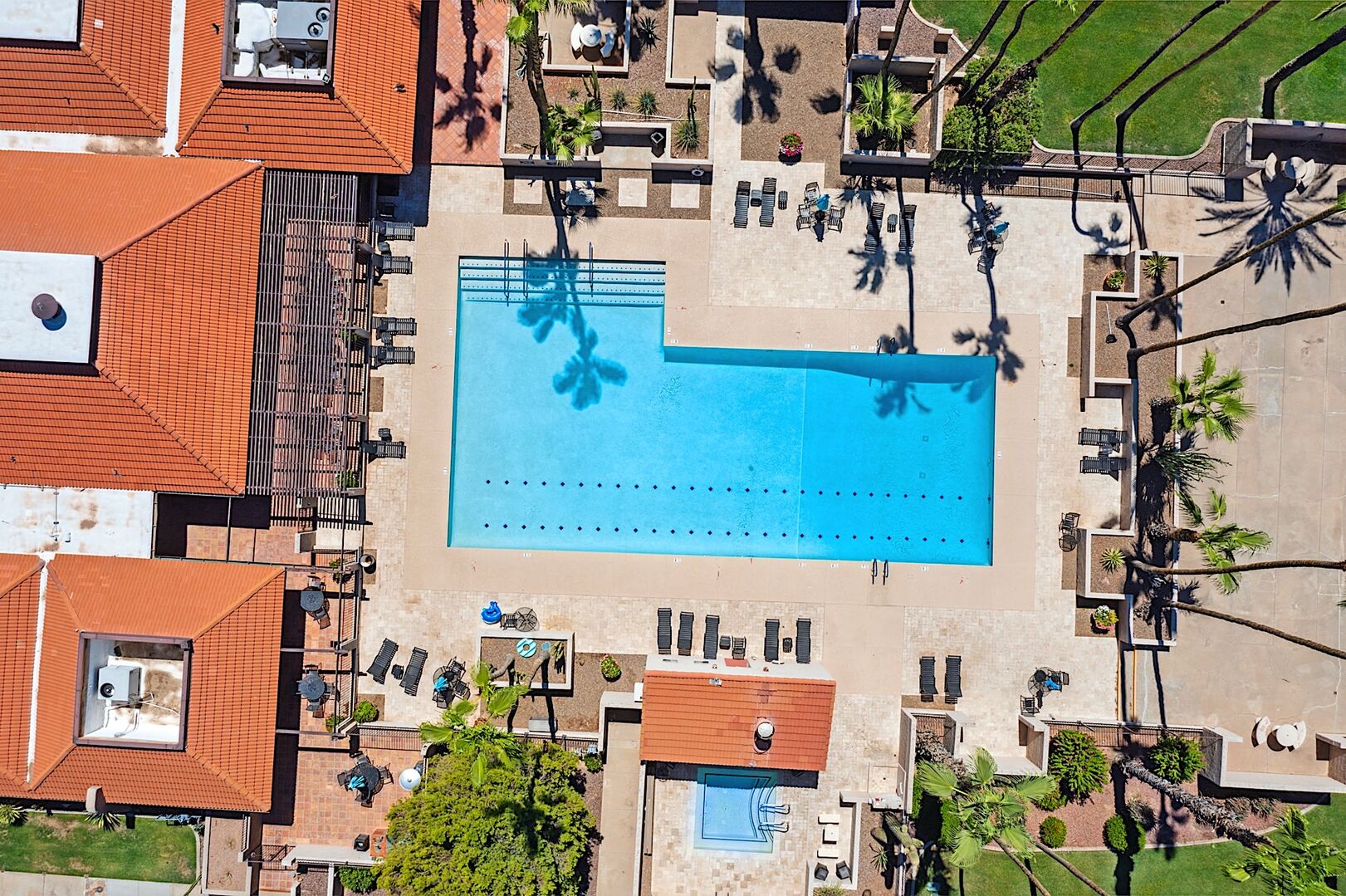 Aerial view of the heated community pool, spa and clubhouse.
