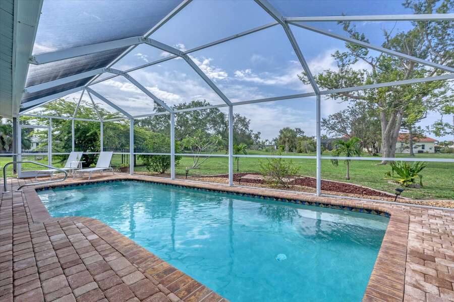 South facing pool with fully screened-in pool cage