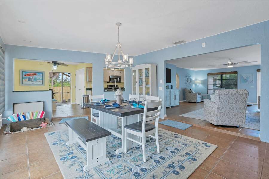 Bright and open dining room overlooks the canal and lanai