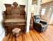 All Hardwood Floors - Antique Organ and Leather Recliner