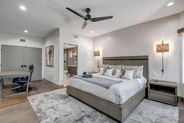 Bedroom Two (Lower Level)- Offers a Spacious Space with King Bed, Desk Area and Sectional Seating Area with 60