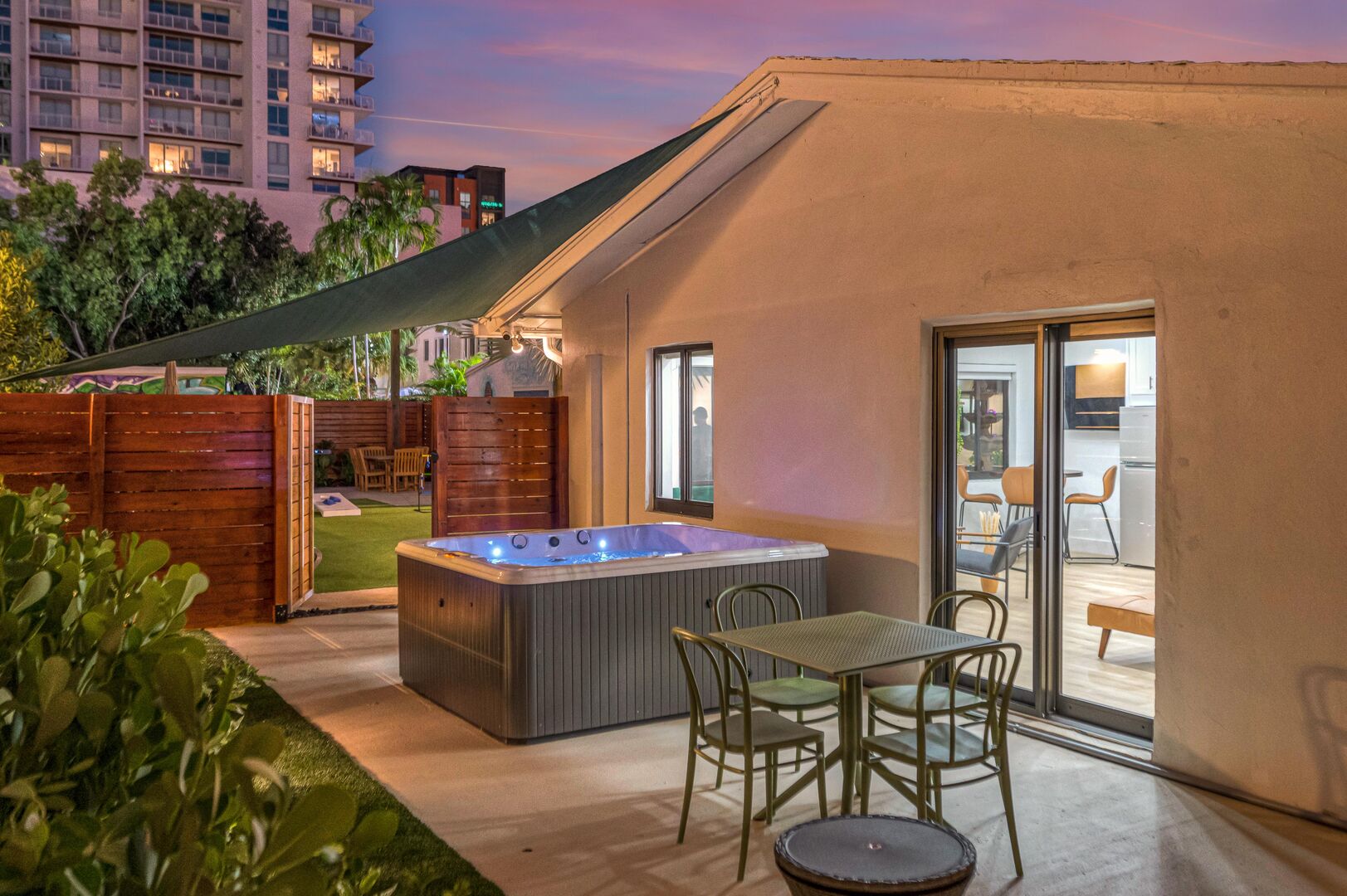The backyard and seating area by the hot tub is private to Suite Seven.