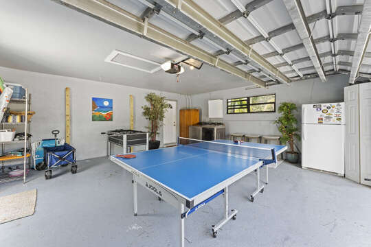 Game room in the garage with pingpong table and foosball