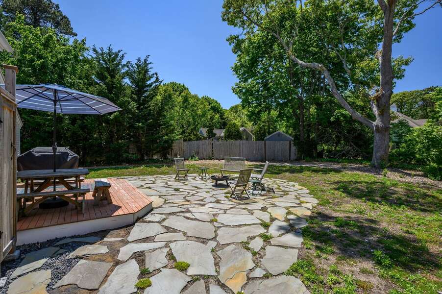 Spacious flagstone patio surrounded by an expansive yard - 158 Riverside Drive West Harwich - Fleetwing - NEVR