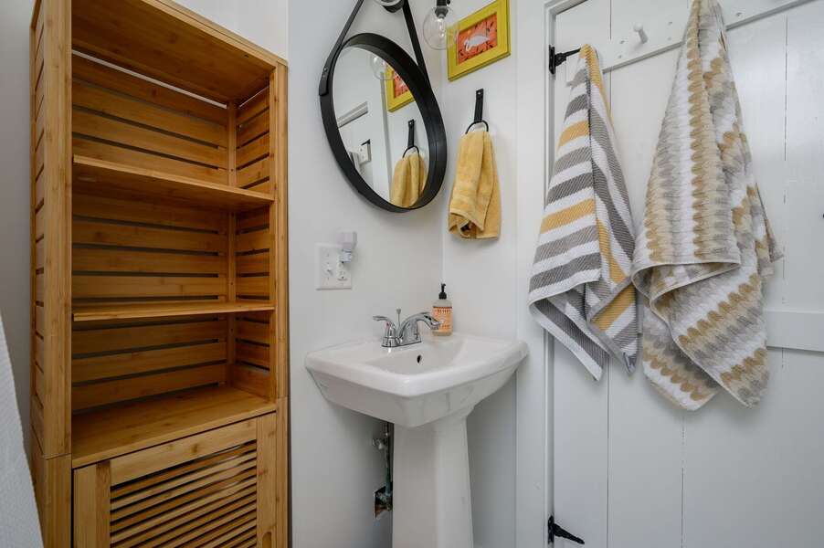 Classic Cape cottage bathroom with plenty of storage - 79 West Road Orleans - Bed Splash and Beyond - NEVR