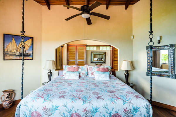 You will find a hanging king-size bed with ceiling fan and air conditioning
