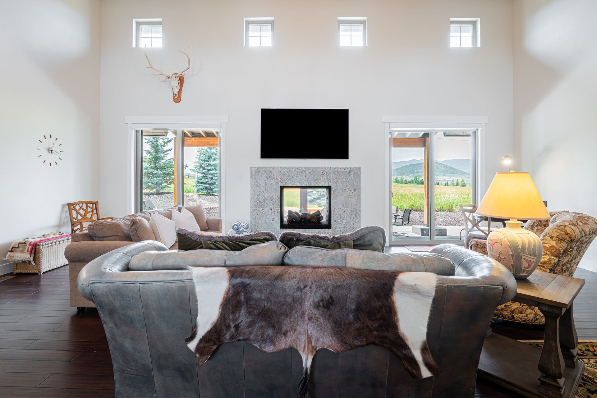 Living Room with see-through gas fireplace and mountain views
