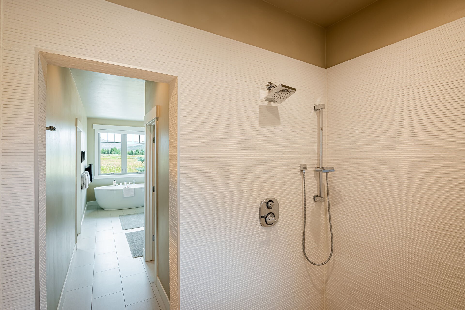 Large spacious walk-in shower with two shower heads