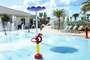 Let your children have fun at the splash pad while you unwind by the pool.